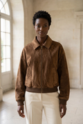 Velours brown suede-look jacket front view in a stone gallery