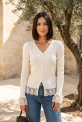 Beige lace-cuff knit top on model