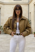 Terre jacket in a stone courtyard