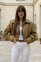 Terre jacket in a stone courtyard