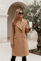 Avenue camel lapel coat in a limestone courtyard