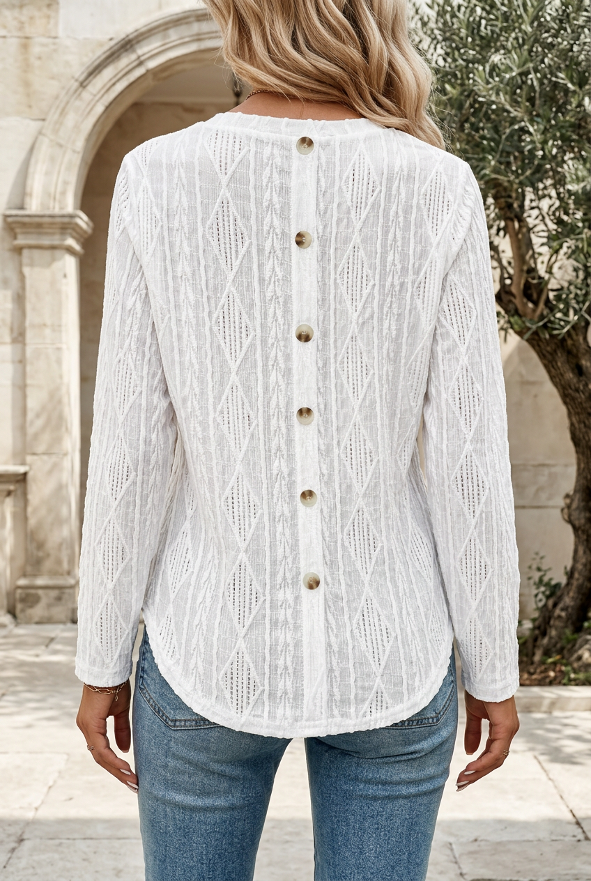 Adèle white top back-button detail on a stone terrace